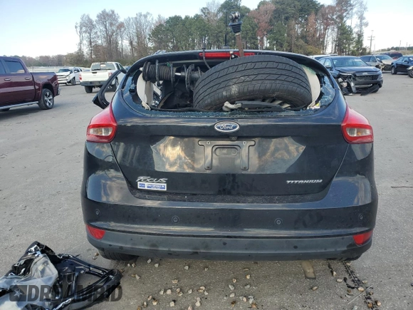 2017 Ford Focus Titanium z VIN 1FADP3N23HL291408, wystawiony jako Copart lot #83876124 z przebiegiem Nie podano mil oraz Szkoda całkowita • Salvage title. Historia ofert i sprzedaży dostępna na DreamBid. Obrazek 6.