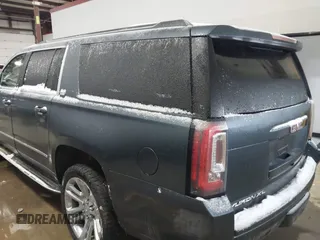 2019 GMC Yukon XL SLT with VIN 1GKS2GKC5KR137005, listed as a IAAI auction lot 41435370 with 125,453 mi miles and . Bid and sale history available at carsss.com. Image 3.
