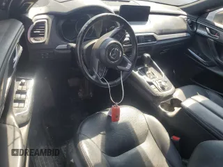 2021 Mazda CX-9 Carbon Edition z VIN JM3TCADY9M0514372, wystawiony jako Copart lot #52902555 z przebiegiem 99 812 mil mil oraz Szkoda całkowita • Salvage title. Historia ofert i sprzedaży dostępna na DreamBid. Obrazek 8.