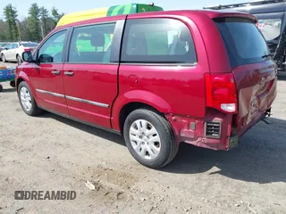 2014 Dodge Grand Caravan American Value with VIN 2C4RDGBG4ER366328, listed as a IAAI auction lot 42127426 with 69,358 mi miles and . Bid and sale history available at DreamBid. Image 3.