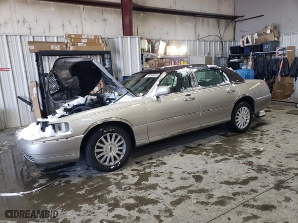 2003 Lincoln Town Car Signature with VIN 1LNHM82W73Y671609, listed as a Copart auction lot 88264385 with 0 mi miles and Salvage Title. Bid and sale history available at carsss.com. Image 1.