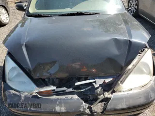 2004 Ford Focus ZTW with VIN 1FAFP35Z84W203676, listed as a Copart auction lot 57272835 with 183,115 mi miles and Salvage title. Bid and sale history available at DreamBid. Image 11.