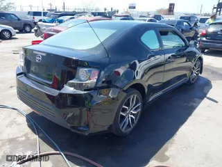 2014 Scion tC with VIN JTKJF5C71E3072199, listed as a IAAI auction lot 41956178 with 154,730 mi miles. Bid and sale history available at carsss.com. Image 4.