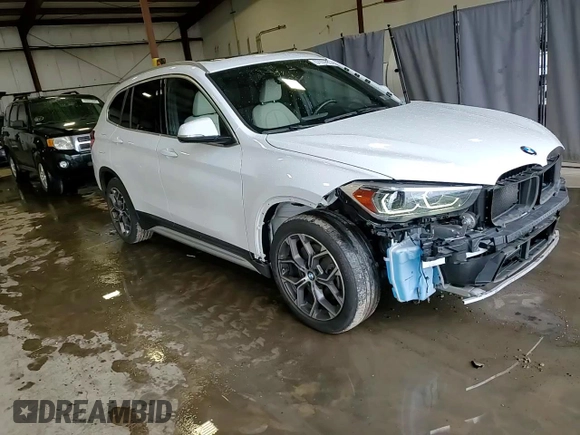 2020 BMW X1 xDrive28i z VIN WBXJG9C09L5P27695, wystawiony jako Copart lot #57039795 z przebiegiem 53 242 mil mil oraz Szkoda całkowita • Salvage title. Historia ofert i sprzedaży dostępna na DreamBid. Obrazek 15.