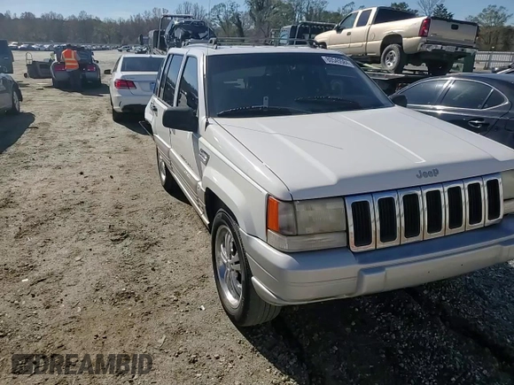 1996 Jeep Grand Cherokee Laredo with VIN 1J4FX58SXTC349575, listed as a Copart auction lot 80545584 with 302,636 mi miles and Salvage Title. Bid and sale history available at carsss.com. Image 11.