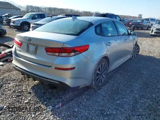 2019 Kia Optima LX with VIN 5XXGT4L35KG359896, listed as a IAAI auction lot 41849243 with 140,975 mi miles. Bid and sale history available at carsss.com. Image 4.