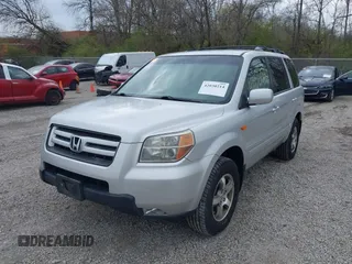 2007 Honda Pilot EX with VIN 5FNYF18457B009707, listed as a IAAI auction lot 42030214 with 229,462 mi miles. Bid and sale history available at carsss.com. Image 2.