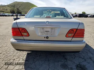 1997 Mercedes-Benz E-Class with VIN WDBJF55F4VJ032270, listed as a Copart auction lot 48010725 with 191,091 mi miles and Salvage Title. Bid and sale history available at carsss.com. Image 6.