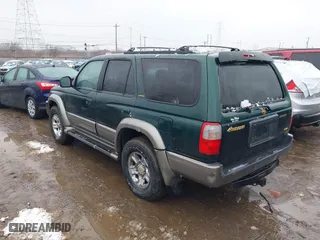 2000 Toyota 4Runner Limited with VIN JT3HN87R6Y0265299, listed as a IAAI auction lot 41569862 with 216,917 mi miles. Bid and sale history available at carsss.com. Image 3.