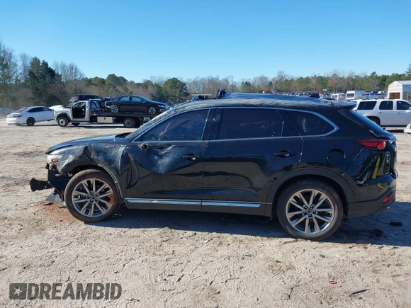2018 Mazda CX-9 Grand Touring z VIN JM3TCADY5J0204845, wystawiony jako IAAI lot #41292695 z przebiegiem 98 751 mil mil oraz . Historia ofert i sprzedaży dostępna na DreamBid. Obrazek 14.