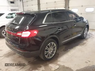 2016 Lincoln MKX Reserve with VIN 2LMTJ8LR8GBL77039, listed as a IAAI auction lot 41894660 with 110,599 mi miles. Bid and sale history available at carsss.com. Image 4.