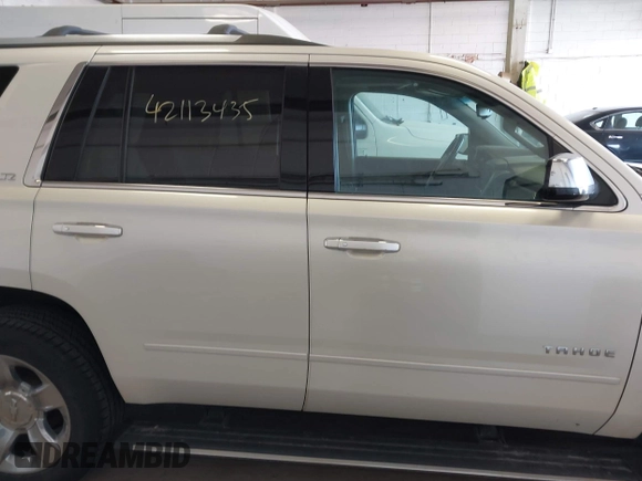 2015 Chevrolet Tahoe LTZ with VIN 1GNSKCKC9FR123996, listed as a IAAI auction lot 42113435 with 149,825 mi miles and . Bid and sale history available at DreamBid. Image 13.