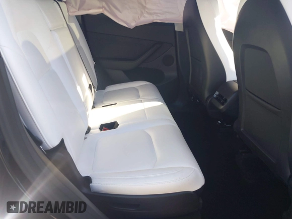 2024 Tesla Model Y Long Range with VIN 7SAYGAEE7RF014424, listed as a IAAI auction lot 41402098 with 6,052 mi miles and . Bid and sale history available at DreamBid. Image 8.