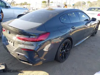 2022 BMW 8 Series M850i with VIN WBAGV8C04NCJ71251, listed as a IAAI auction lot 41657273 with 40,038 mi miles. Bid and sale history available at carsss.com. Image 4.