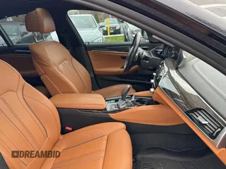 2018 BMW 5 Series M550i xDrive with VIN WBAJB9C57JB035521, listed as a Copart auction lot 54177125 with 63,924 mi miles and Clean Title. Bid and sale history available at carsss.com. Image 5.
