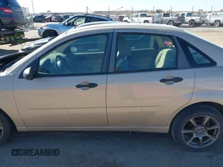2007 Ford Focus S z VIN 1FAFP34N47W298854, wystawiony jako IAAI lot #41814627 z przebiegiem 126 781 mil mil oraz . Historia ofert i sprzedaży dostępna na DreamBid. Obrazek 15.
