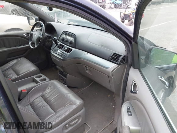 2009 Honda Odyssey EX-L with VIN 5FNRL38769B409281, listed as a IAAI auction lot 42013137 with 213,934 mi miles and . Bid and sale history available at DreamBid. Image 5.