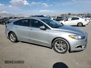 2018 Ford Fusion SE z VIN 3FA6P0LU7JR139974, wystawiony jako Copart lot #69819394 z przebiegiem 164 123 mil mil oraz Szkoda całkowita • Salvage title. Historia ofert i sprzedaży dostępna na DreamBid. Obrazek 4.
