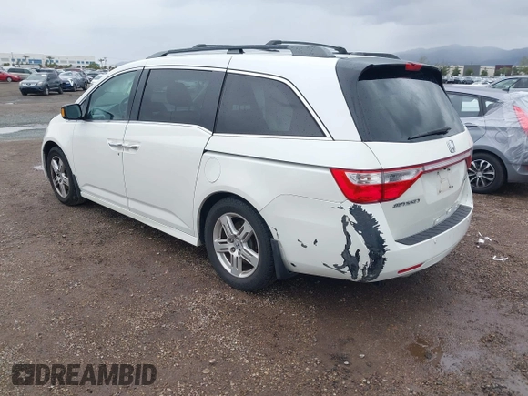 2013 Honda Odyssey Touring with VIN 5FNRL5H99DB041328, listed as a IAAI auction lot 41797520 with 148,523 mi miles and . Bid and sale history available at carsss.com. Image 3.