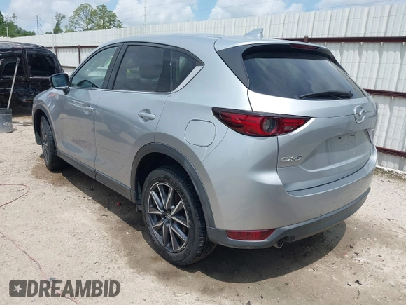 2018 Mazda CX-5 Grand Touring with VIN JM3KFADM6J0339185, listed as a IAAI auction lot 42160763 with 86,312 mi miles and . Bid and sale history available at DreamBid. Image 3.