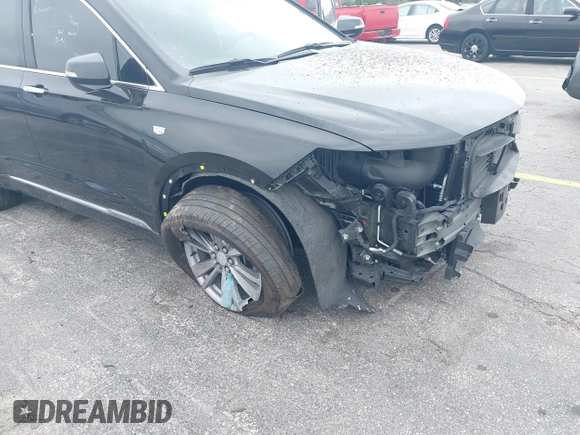 2023 Cadillac XT6 FWD Premium Luxury with VIN 1GYKPCRS6PZ106284, listed as a IAAI auction lot 41595617 with 32,795 mi miles and . Bid and sale history available at DreamBid. Image 18.