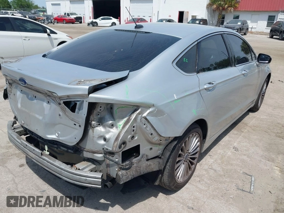 2014 Ford Fusion Titanium with VIN 3FA6P0K99ER358244, listed as a IAAI auction lot 42085703 with 194,626 mi miles. Bid and sale history available at carsss.com. Image 4.