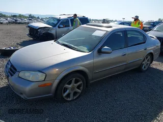 2001 Nissan Maxima GLE z VIN JN1CA31A41T304048, wystawiony jako IAAI lot #42170749 z przebiegiem 215 284 mil mil oraz . Historia ofert i sprzedaży dostępna na DreamBid. Obrazek 2.