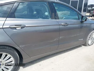 2013 Ford Fusion SE Hybrid with VIN 3FA6P0LU3DR338282, listed as a IAAI auction lot 41973498 with 187,375 mi miles. Bid and sale history available at carsss.com. Image 6.