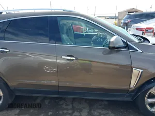 2016 Cadillac SRX Performance Collection z VIN 3GYFNCE39GS512286, wystawiony jako IAAI lot #42392467 z przebiegiem 95 708 mil mil oraz . Historia ofert i sprzedaży dostępna na DreamBid. Obrazek 13.