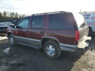 1999 GMC Yukon with VIN 1GKEK13R2XJ728279, listed as a Copart auction lot 84099064 with 162,131 mi miles and Clean Title. Bid and sale history available at carsss.com. Image 2.
