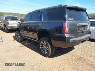 2018 GMC Yukon Denali with VIN 1GKS2CKJ6JR303263, listed as a IAAI auction lot 41633514 with 130,990 mi miles. Bid and sale history available at carsss.com. Image 3.