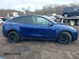 2023 Tesla Model Y Long Range with VIN 7SAYGDEE4PF891709, listed as a IAAI auction lot 41944893 with 15,864 mi miles. Bid and sale history available at carsss.com. Image 13.