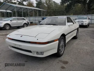 1988 Toyota Supra z VIN JT2MA71J0J0088041, wystawiony jako Copart lot #84402804 z przebiegiem 195 921 mil mil oraz Czysty tytuł • Clean title. Historia ofert i sprzedaży dostępna na DreamBid. Obrazek 1.