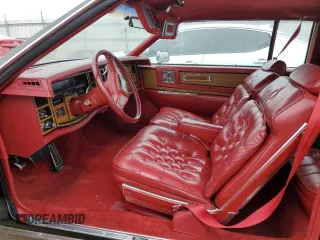 1985 Cadillac Eldorado z VIN 1G6EL5782FE634074, wystawiony jako Copart lot #44520964 z przebiegiem 74 425 mil mil oraz Szkody całkowita. Historia ofert i sprzedaży dostępna na DreamBid. Obrazek 7.