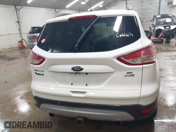 2014 Ford Escape SE with VIN 1FMCU9G99EUC15477, listed as a IAAI auction lot 42147162 with 98,886 mi miles and . Bid and sale history available at DreamBid. Image 16.