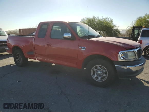 1999 Ford F-150 with VIN 1FTRX07W2XKC24186, listed as a Copart auction lot 74553294 with Not provided miles and Salvage title. Bid and sale history available at DreamBid. Image 4.