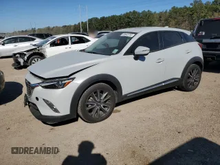 2018 Mazda CX-3 Grand Touring z VIN JM1DKFD77J0310587, wystawiony jako Copart lot #49443755 z przebiegiem 70 897 mil mil oraz Szkody całkowita. Historia ofert i sprzedaży dostępna na DreamBid. Obrazek 1.