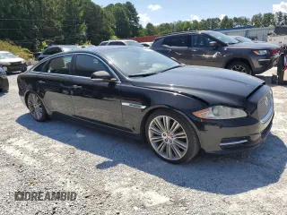 2014 Jaguar XJ Portfolio with VIN SAJWA2GZ2E8V66906, listed as a Copart auction lot 64888135 with 166,194 mi miles and Clean title. Bid and sale history available at DreamBid. Image 4.