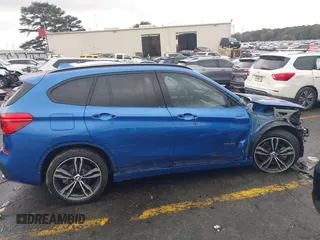 2016 BMW X1 xDrive28i with VIN WBXHT3C31G5E55119, listed as a IAAI auction lot 40894704 with 126,561 mi miles. Bid and sale history available at carsss.com. Image 13.