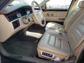 1995 Cadillac Concours z VIN 1G6KF52Y1SU245573, wystawiony jako Copart lot #68715984 z przebiegiem Nie podano mil oraz Szkody całkowita. Historia ofert i sprzedaży dostępna na DreamBid. Obrazek 7.