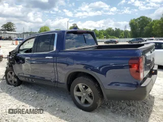 2023 Honda Ridgeline RTL-E with VIN 5FPYK3F74PB037333, listed as a Copart auction lot 56209715 with 36,041 mi miles and Salvage title. Bid and sale history available at DreamBid. Image 2.
