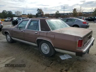 1989 Ford Crown Victoria z VIN 2FABP74F3KX157785, wystawiony jako Copart lot #84102954 z przebiegiem 68 996 mil mil oraz Czysty tytuł • Clean title. Historia ofert i sprzedaży dostępna na DreamBid. Obrazek 2.