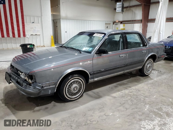 1991 Oldsmobile Cutlass Ciera with VIN 2G3AM54N8M2304905, listed as a Copart auction lot 52047535 with 28,749 mi miles and Salvage Title. Bid and sale history available at DreamBid. Image 1.