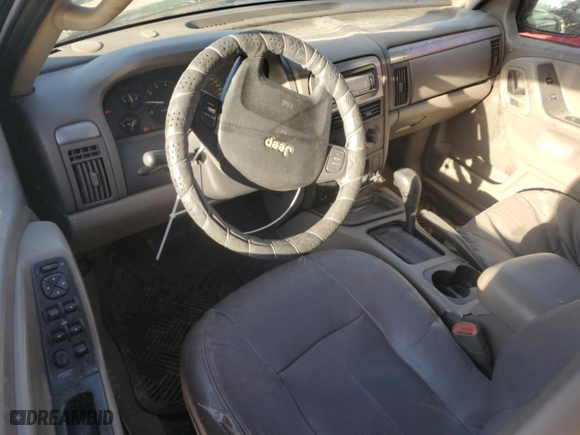 2004 Jeep Grand Cherokee Laredo with VIN 1J4GX48S64C165105, listed as a Copart auction lot 50301455 with 299,686 mi miles and Salvage Title. Bid and sale history available at carsss.com. Image 8.