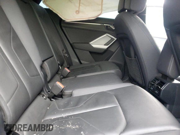 2023 Audi Q3 S line Premium z VIN WA1DECF35P1094199, wystawiony jako Copart lot #52099525 z przebiegiem 50 304 mil mil oraz Szkody całkowita. Historia ofert i sprzedaży dostępna na DreamBid. Obrazek 11.