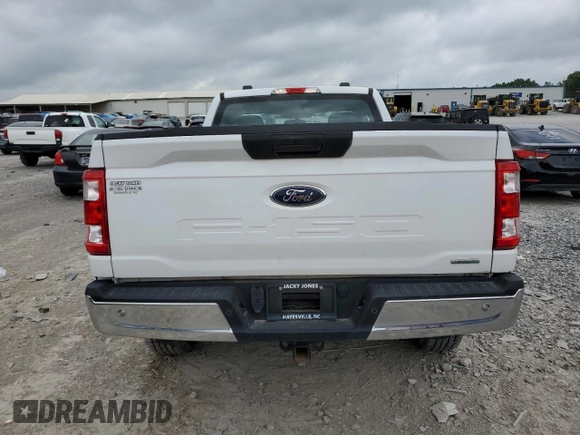 2021 Ford F-150 XL with VIN 1FTMF1EP7MKE72931, listed as a Copart auction lot 60650605 with 23,825 mi miles and Salvage title. Bid and sale history available at DreamBid. Image 6.