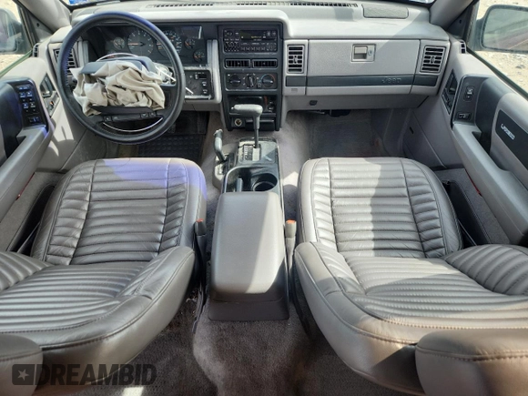 1994 Jeep Grand Cherokee Laredo z VIN 1J4GZ58S0RC221854, wystawiony jako Copart lot #61950825 z przebiegiem 69 465 mil mil oraz Czysty tytuł • Clean title. Historia ofert i sprzedaży dostępna na DreamBid. Obrazek 8.