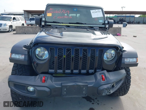 2021 Jeep Gladiator Rubicon z VIN 1C6JJTBG6ML535939, wystawiony jako IAAI lot #42260764 z przebiegiem 114 060 mil mil oraz . Historia ofert i sprzedaży dostępna na DreamBid. Obrazek 6.