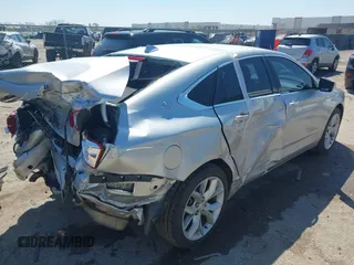 2014 Chevrolet Impala LT with VIN 2G1125S35E9102161, listed as a IAAI auction lot 41976891 with 129,408 mi miles and . Bid and sale history available at DreamBid. Image 4.
