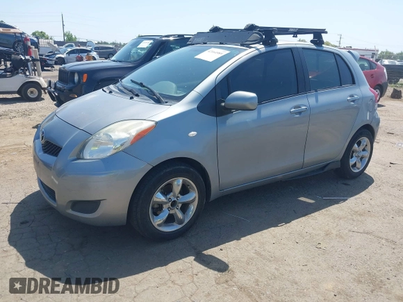2009 Toyota Yaris with VIN JTDKT903195235991, listed as a IAAI auction lot 42164989 with 249,389 mi miles. Bid and sale history available at carsss.com. Image 2.
